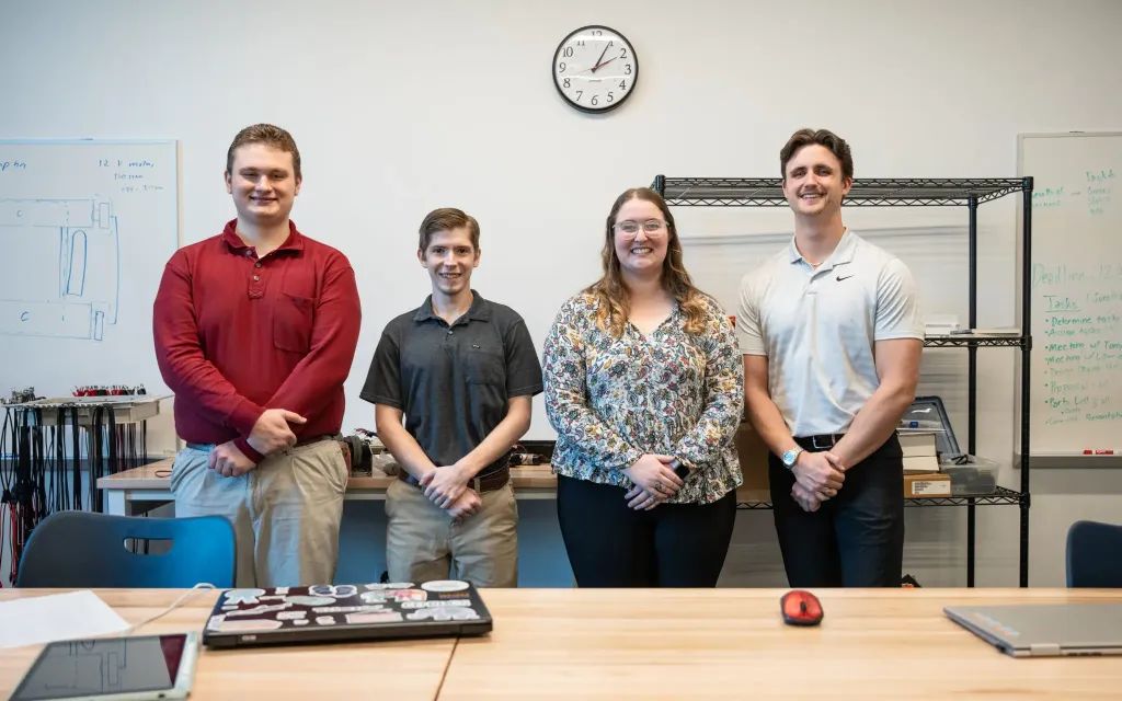 Charleston Southern senior engineering students design robot to benefit university.