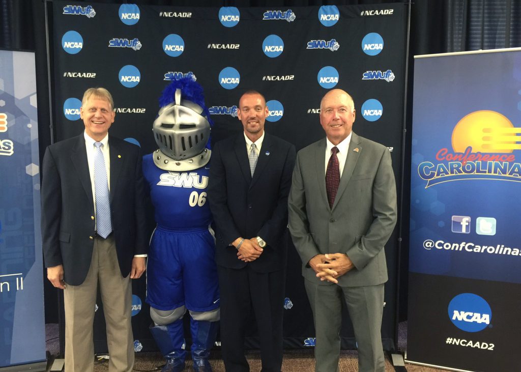 (L-R) Dr. Todd Voss, SWU president; SWU Warrior mascot, Chris Williams SWU director of athletics; Dr. Alan Patterson, Conference Carolinas commissioner.
