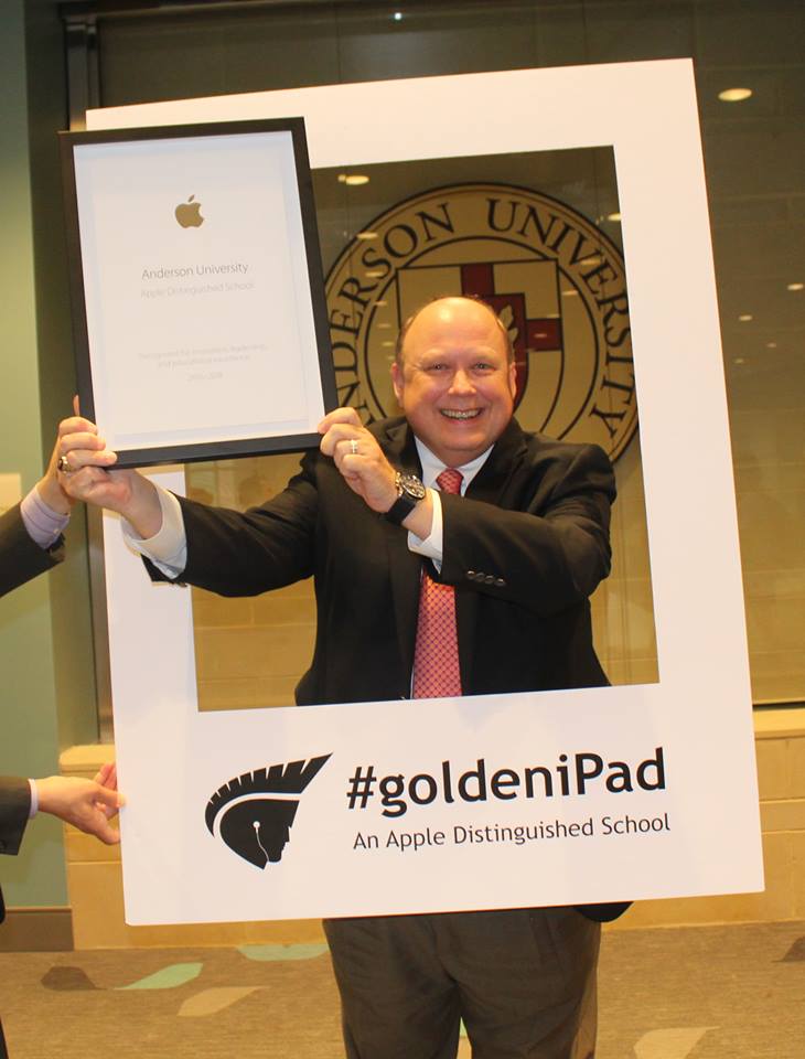 Dr. Evans Whitaker, President, accepting Apple Distinguished School Award on behalf of Anderson University.