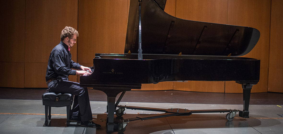 Matthew Stalnaker, recent Coker graduate, playing a Steinway piano at Coker.