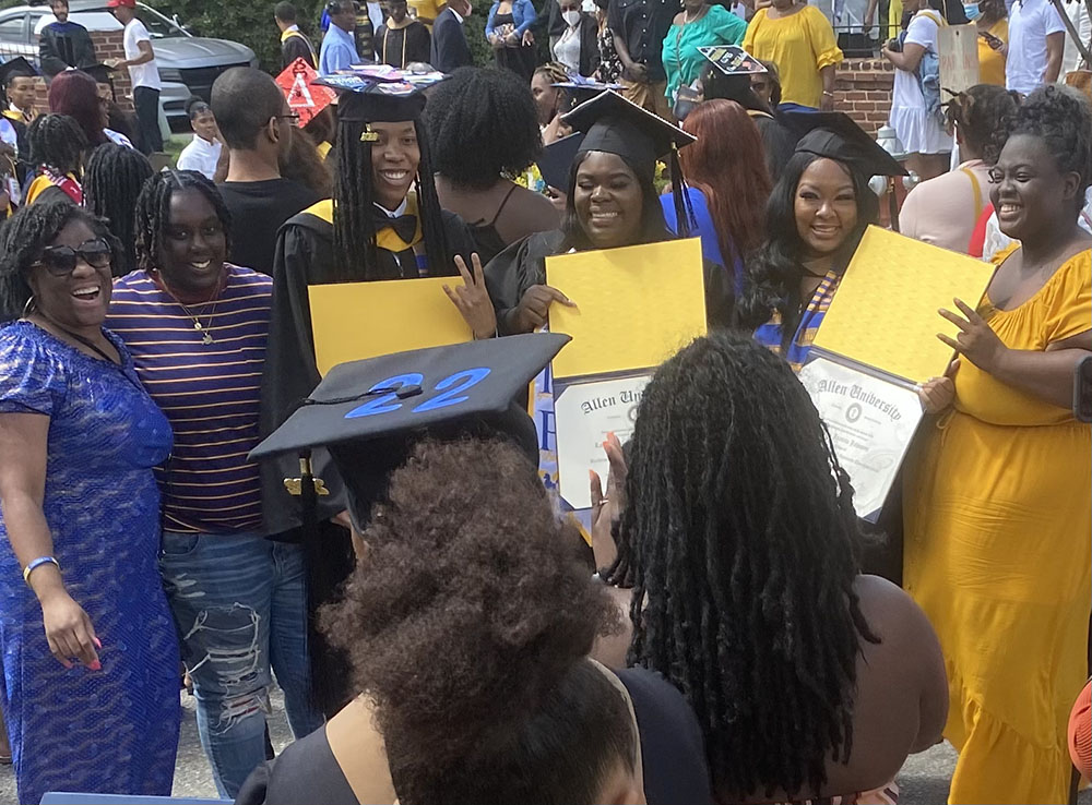 Allen University graduates celebrate after commencement ceremony.